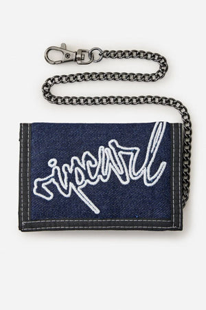 The Rip Curl Archive Denim Surf Wallet is a blue wallet with a white embroidered logo, dark trim, and an attached metal chain. Stylish and practical, itβs perfect for everyday surf-inspired adventures. Displayed on a white background.