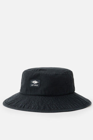 The Rip Curl Classic Surf Mid Brim Hat, in black and made from cotton, boasts a wide brim and a small rectangular logo patch on the front. Ideal for outdoor adventures, this hat is showcased against a plain white background.