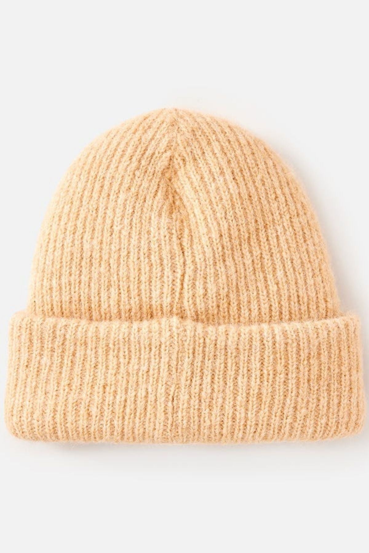 The Rip Curl Classic Surf Tall Beanie in beige features a knitted design, wide folded brim, and tall fit for ultimate insulation, shown against a plain light background.