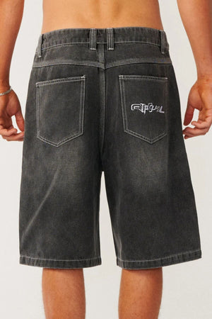 Back view of relaxed baggy Rip Curl Archive Dirty Denim Walkie Walkshort in black with white contrast stitching and an embroidered logo on the back right pocket.