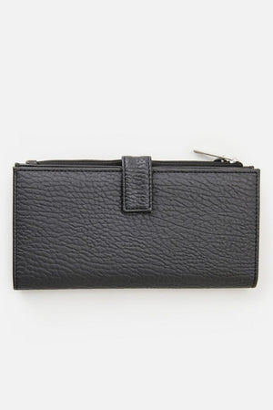 The Rip Curl Essentials II Phone Wallet is a sleek black accessory made from textured leather, featuring a zipper closure and flap. Its rectangular shape elegantly lies flat against a white background, drawing attention to the handy mobile phone pocket tucked inside, with the zipper pull prominently visible at the top right corner.