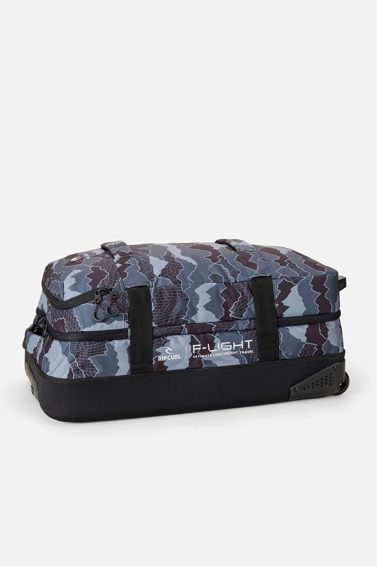 The Rip Curl F-Light Global 100L Search Camo Travel Bag is a large rectangular soft-sided duffel with wheels, made from recycled polyester, featuring a blue and gray camo pattern, black base and handles, shown on a plain white background.