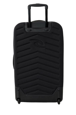 The Rip Curl F-Light Global 100L Search Camo Travel Bag features a hard-shell design with a chevron pattern, two wheels, and a top telescopic handle. The Rip Curl logo appears subtly on the front of this black travel case.