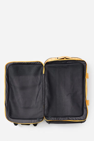 Open, empty yellow Rip Curl F-Light Global 100L Tropics Travel Bag with black recycled polyester interior, mesh lining, and lockable zips. Viewed from above against a plain white background, both sides are visible.