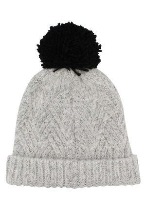 The Rip Curl Groundswell Pom Pom Beanie in gray sports a fashionable black pom-pom on top. This chic accessory boasts a textured pattern and a folded brim, making it ideal for cold weather.