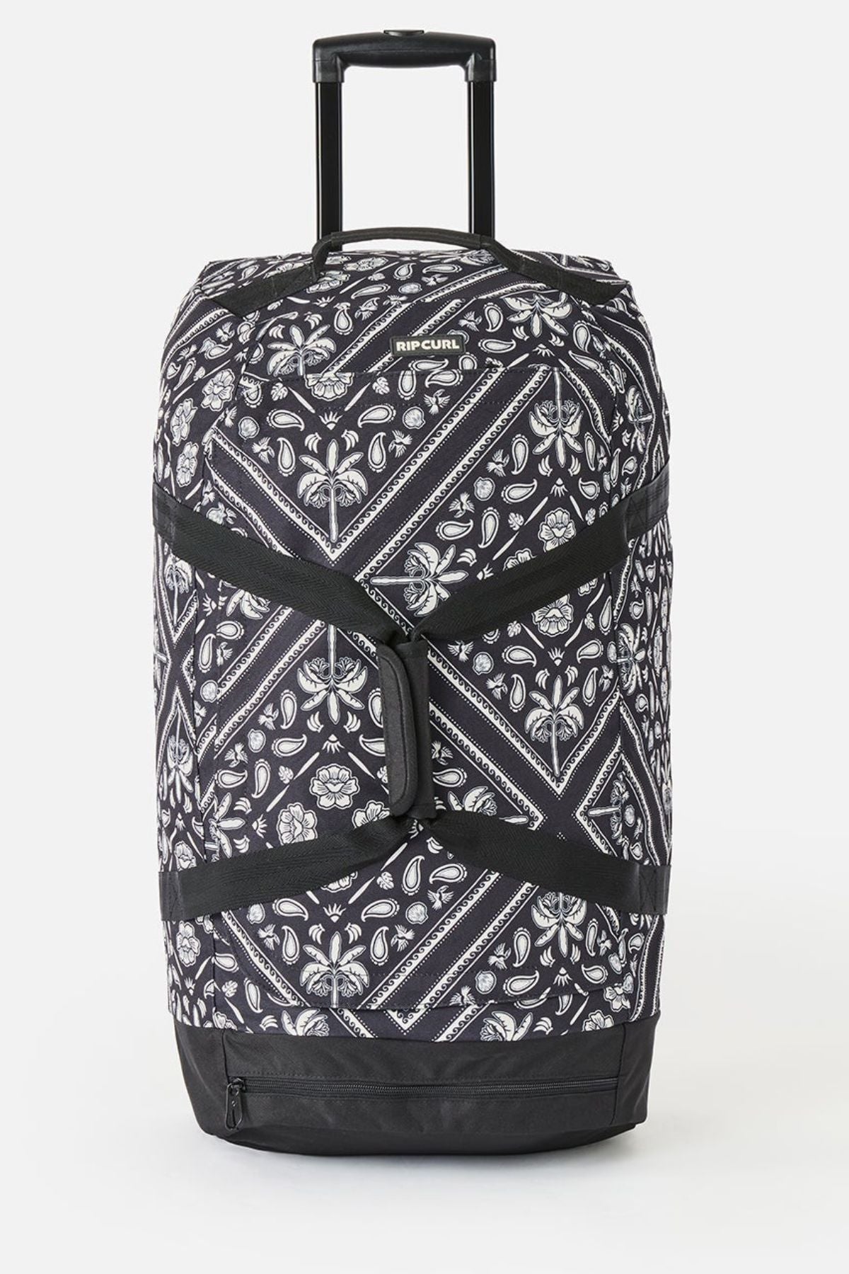 The Rip Curl Jupiter 80L Mixed Travel Bag is a large black and white travel bag with a paisley pattern, telescopic and side handles, 80L capacity, made from recycled polyester. "RIP CURL" branding appears at the top.