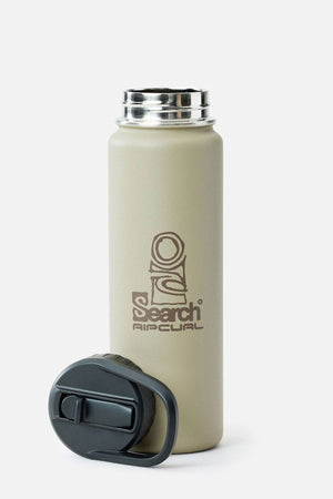 A beige Rip Curl Logo Drink Bottle 710ML with double-walled insulation, stainless steel rim, black screw-on lid beside it, and “Search Airculal” logo on the front is showcased against a plain light gray background.