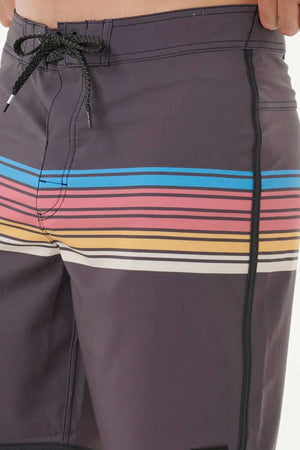 A close-up of a person wearing the Rip Curl Mirage Surf Revival 19" Boardshort in dark, quick-drying recycled PET, with blue, pink, orange, and white thigh stripes, black drawstrings, and side stitching.