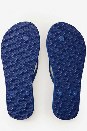 Rip Curl Mixed Bloom Thongs in blue, shown from the bottom, feature textured soles and circular left/right markings. Crafted with comfortable flip-flop design and algae-blended EVA foam.