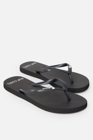 A pair of Rip Curl Premium Surf Bloom Thongs with a simple design, featuring the brand name "Rip Curl" printed in white on the straps and footbed. The black straps have a subtle texture, and the flip-flops have a plain rubber sole. The image is on a white background.