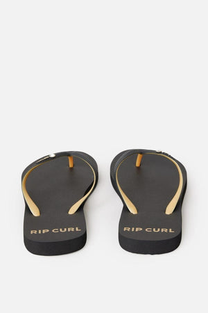 A pair of Rip Curl Premium Surf Bloom Thongs in black with yellow straps and the brand name "Rip Curl" printed on the heels. The thongs are positioned side by side, with the straps facing upward against a white background.