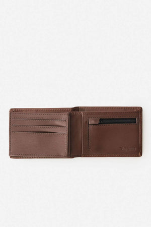 The Rip Curl Raw Energy RFID Slim Wallet in brown buff cow leather is open, displaying card slots on the left and a zippered coin pocket on the right against a plain light background.