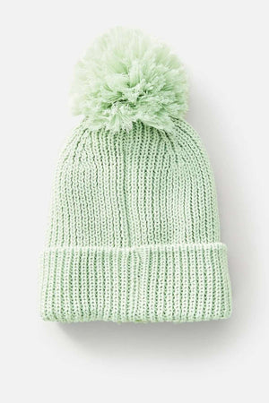 Presenting the Rip Curl Sol Seeker Pom Pom Beanie in mint green, this stylish accessory features a large pom-pom at the top and is adorned with a cozy teddy fur lining. Crafted from recycled polyester, it's displayed against a plain white background.