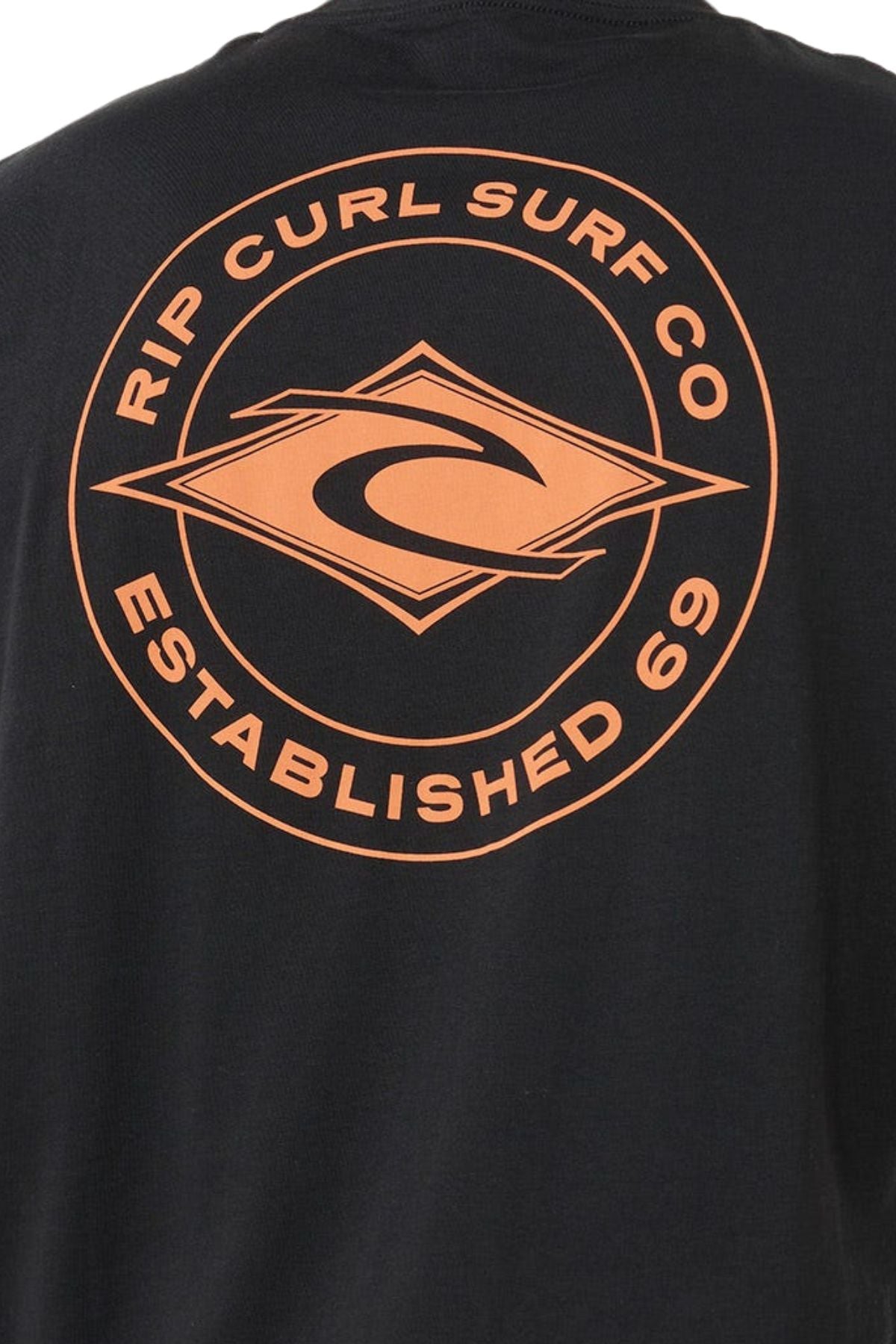 The Rip Curl Staple Muscle shirt in black features an orange circular "Rip Curl Surf Co Established 69" logo with a wave graphic on the back. Made from 100% cotton for comfort and style.