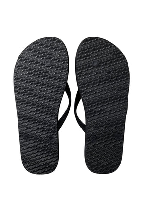 The Rip Curl Surf Revival Bloom Thongs are shown with black ergonomic rubber straps, textured soles, and a premium EVA footbed, all displayed against a clean white background.