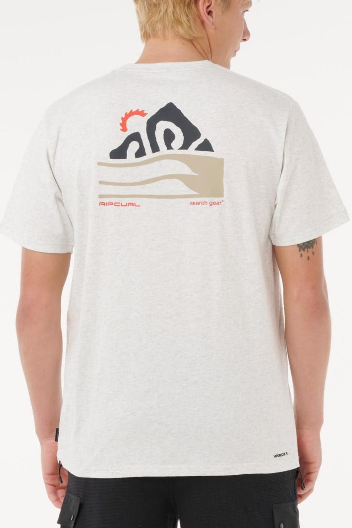 A person with short blonde hair is shown from behind wearing the Rip Curl Vaporcool Search Range Tee—a light gray, quick-drying, moisture-wicking shirt with a black, beige, and red “RIP CURL search gear” graphic on the back.