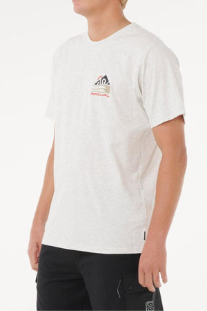 A person wears the Rip Curl Vaporcool Search Range Tee in light gray with a small chest logo and black pants, standing against a plain white background. This quick-drying, short-sleeve shirt offers all-day comfort.