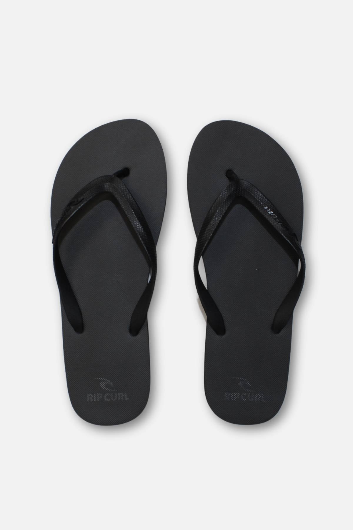 A pair of Rip Curl Brand Logo Bloom Thongs in black with a simple, ergonomic moulded design, shown side by side on a plain white background.