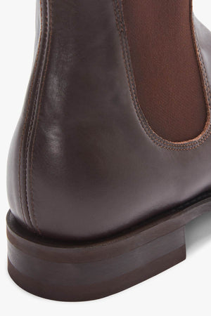 Close-up of the heel and back of the RM Williams Comfort Craftsman Boot, a brown handcrafted leather Chelsea boot with brown elastic side panel and visible stitching detail.