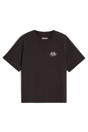 The RM Williams Kandos Tee is a plain black short-sleeve Australian cotton t-shirt featuring a small white B.M. Williams logo on the left chest, shown against a white background.