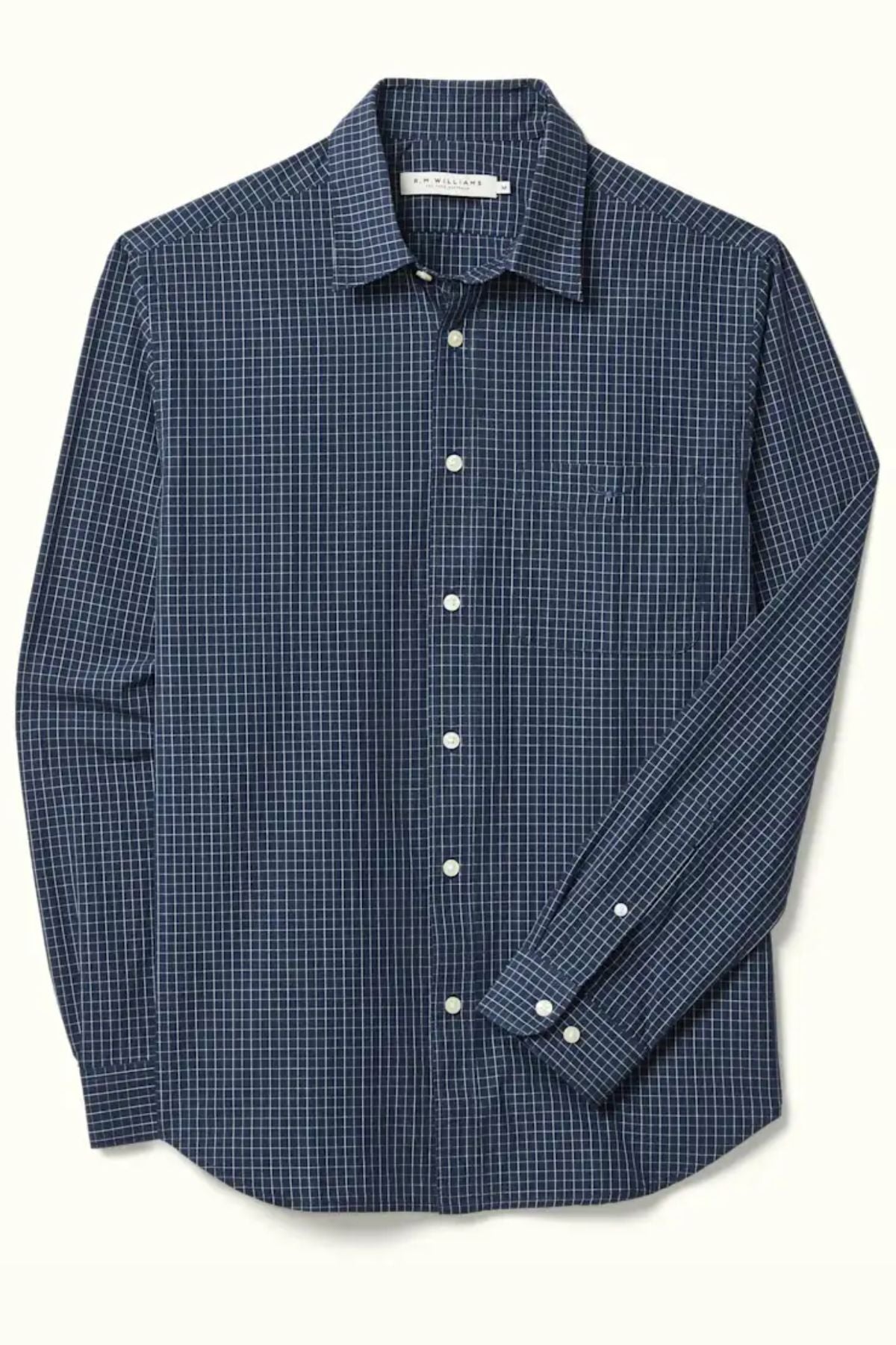 The RM Williams Kimberley Regular Poplin Shirt is a long-sleeve, blue and white checkered shirt with a single chest pocket, white buttons, and a regular fit for all-day comfort.