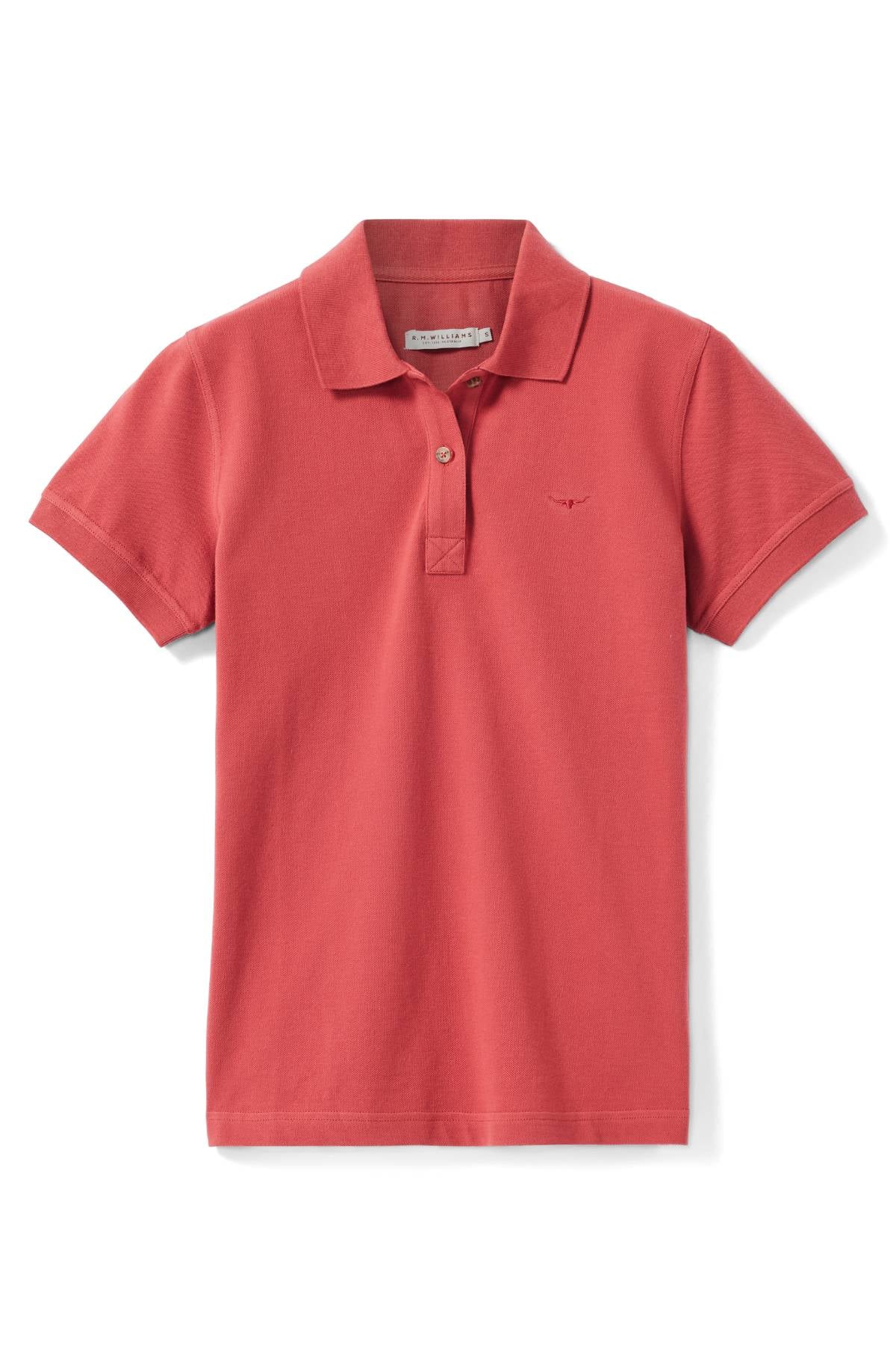 The RM Williams Margaret Polo is a plain red short-sleeve polo in organic cotton, with a collar, two-button placket, and a small chest logo, shown laid flat on a white background.