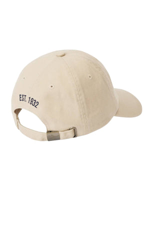 The RM Williams Mini Longhorn Twill Cap, shown from the back in beige organic cotton, has an adjustable strap and "EST. 1932" embroidered in black above the opening.