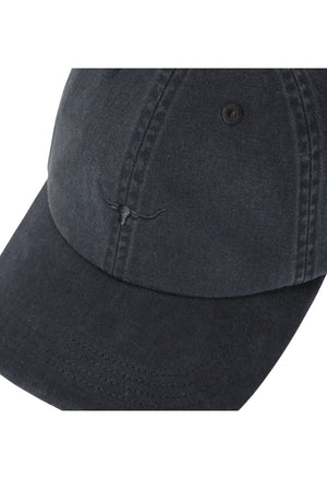 A close-up of the RM Williams Mini Longhorn Twill Cap, a black organic cotton baseball cap with visible stitching and a subtle embroidered longhorn skull outline on the front panel.