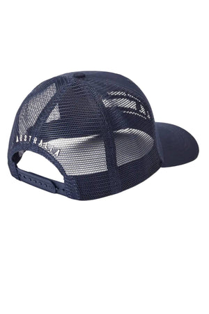 The RM Williams Stencil Trucker Cap is shown from the back in navy blue mesh, with a snap adjuster and "AUSTRALIA" embroidered in white stencil graphic on the left side.