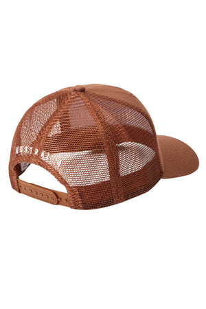 The RM Williams Stencil Trucker Cap is a brown organic cotton twill hat with a mesh back and snap adjuster, featuring an RM Williams stencil graphic and “AUSTRALIA” printed in white near the left back strap.
