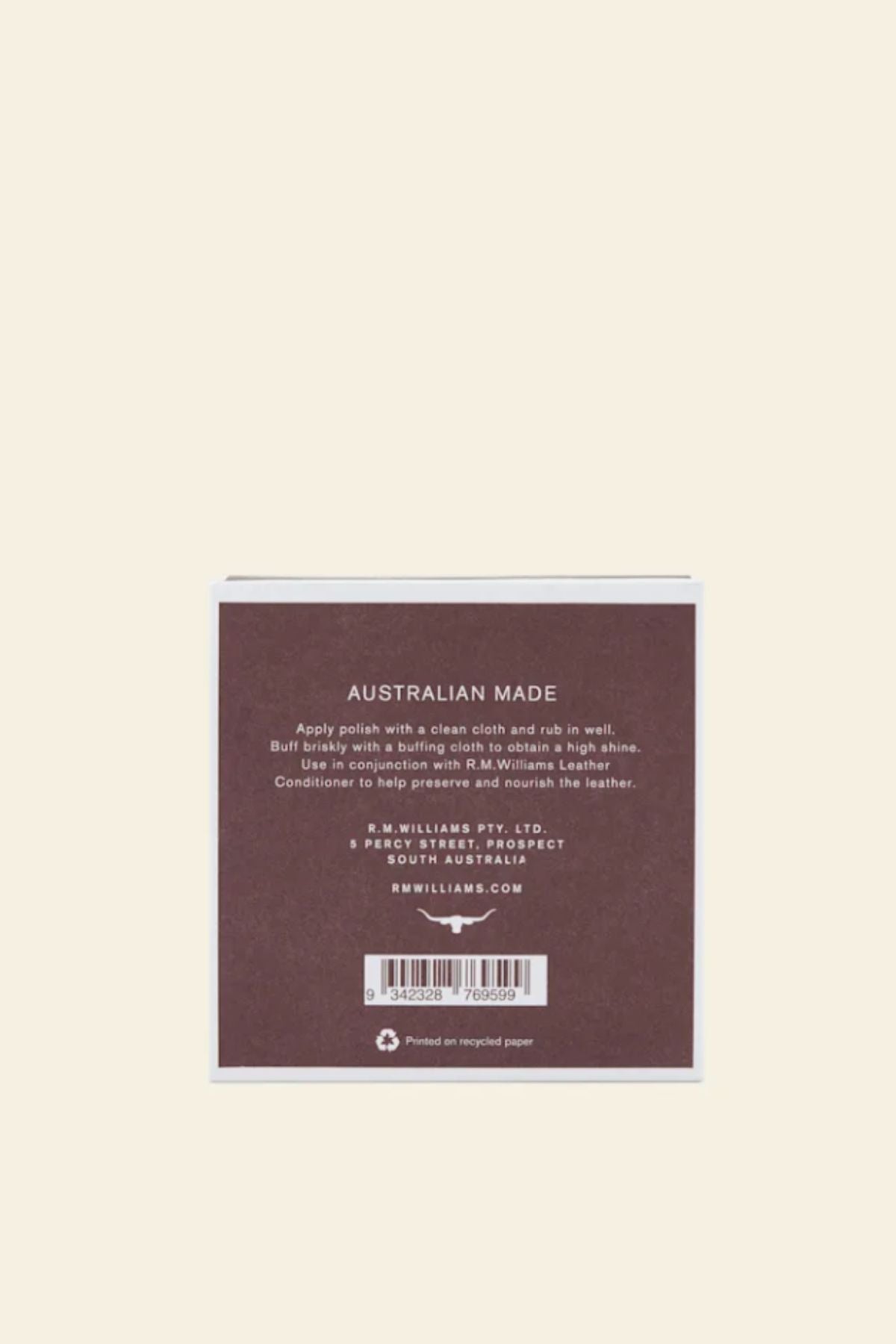 A square brown box with white text displays care instructions and company details for RM Williams Stockmans Boot Polish. It notes Australian made and printed on recycled paper.
