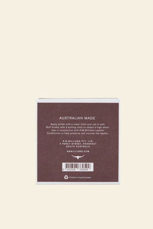A square brown box with white text displays care instructions and company details for RM Williams Stockmans Boot Polish. It notes Australian made and printed on recycled paper.