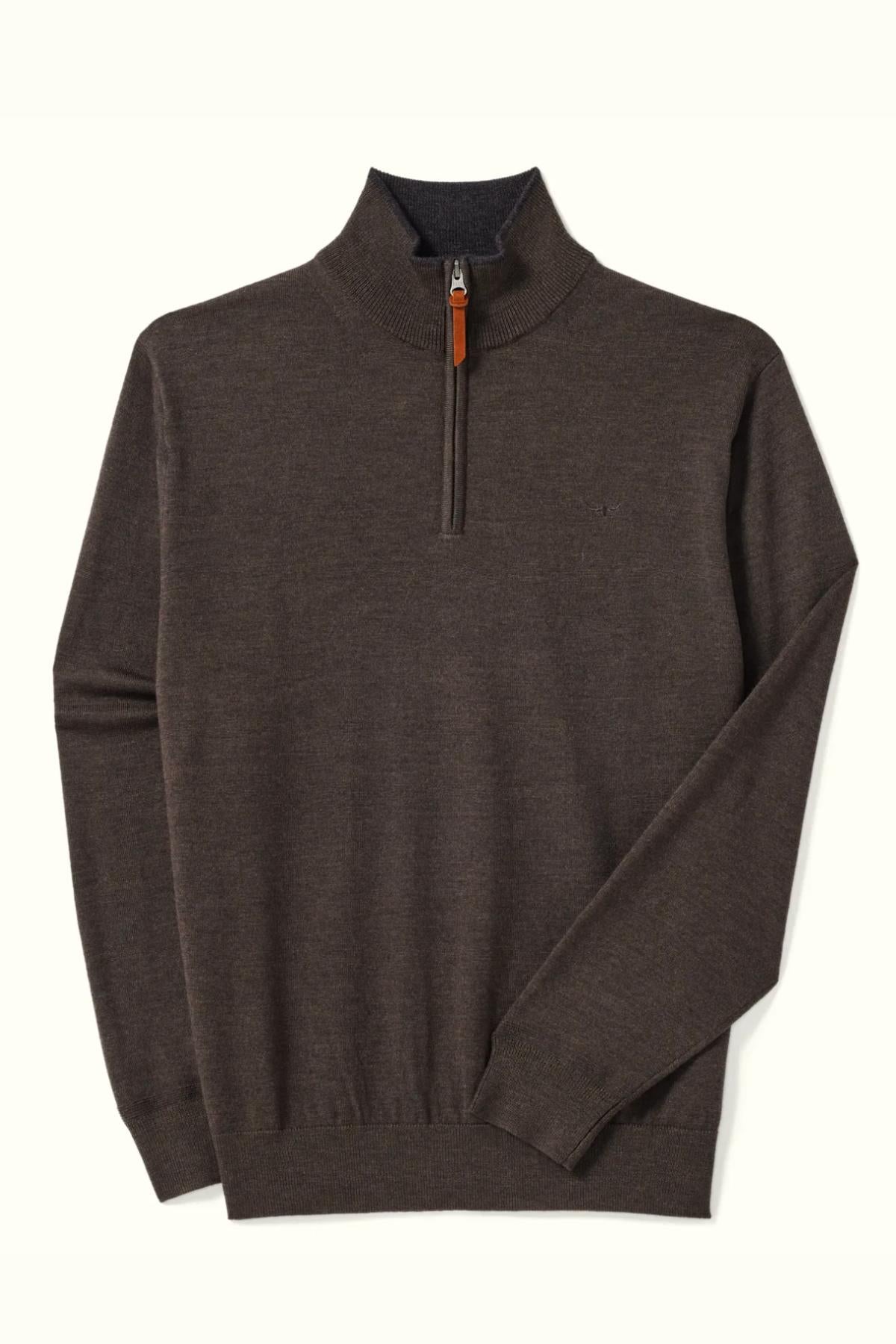 The RM Williams Ernest 1/4 Zip Merino Knit, a brown sweater crafted from Australian extra-fine merino wool with ribbed collar, cuffs and hem, plus a leather pull-tab zipper, is shown laid flat on a light background.