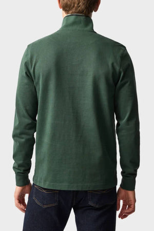 A person is shown from the back against a plain light background, wearing the Rodd & Gunn Gunn 14oz 1/4 Zip Sweat in dark green and dark blue jeans.
