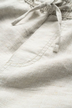 Close-up of the Rodd & Gunn Linen Resort Short in light beige, showcasing a drawstring waistband and a side pocket with visible stitching.