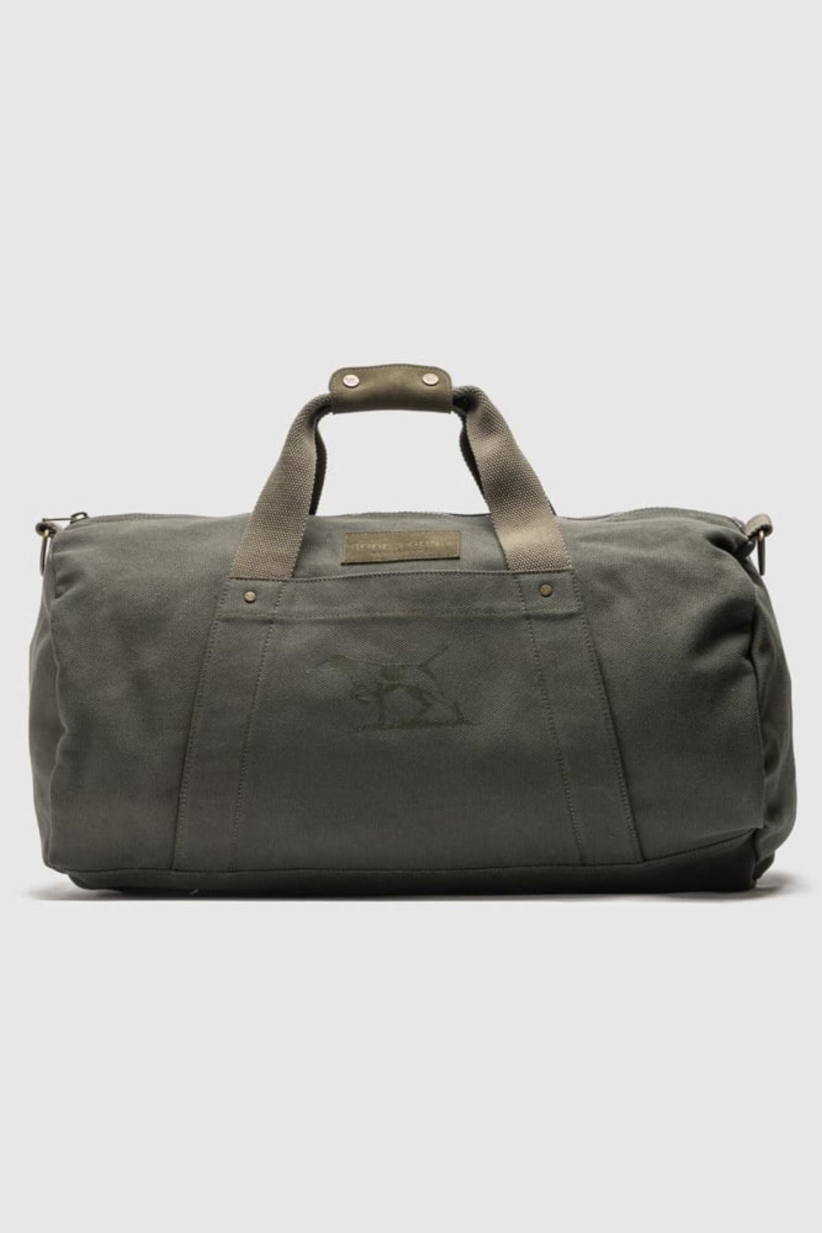 The Rodd & Gunn Ponsonby Road Duffle Bag is a dark green cotton canvas bag with short handles, a shoulder strap, and a subtle embroidered animal logo on the front against a plain light background.