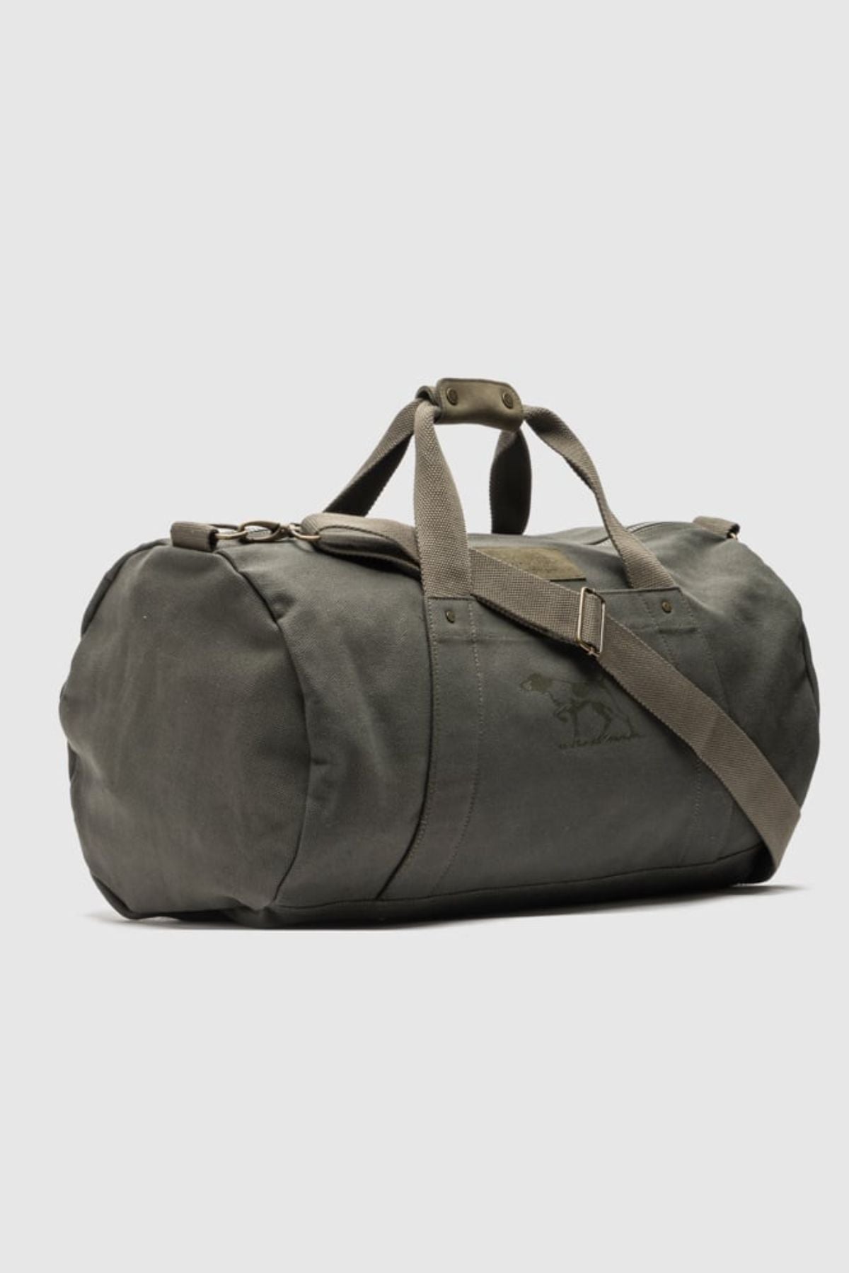 The Rodd & Gunn Ponsonby Road Duffle Bag features a large olive green cotton canvas body, two top handles, and an adjustable shoulder strap, displayed against a plain light gray background.
