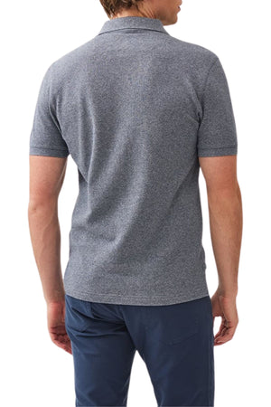 A man is seen from the back wearing a modern fit, short-sleeve Rodd & Gunn The Gunn Polo made from Australian cotton with dark blue pants, set against a white background.