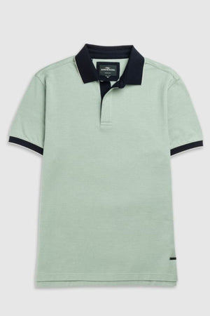The Rodd & Gunn Wilson Bay Sports Fit Polo is a light green shirt featuring a dark collar and cuffs. Made from breathable birdseye knit, it has a subtle striped texture and a discreet logo near the hem, delivering comfort and style.