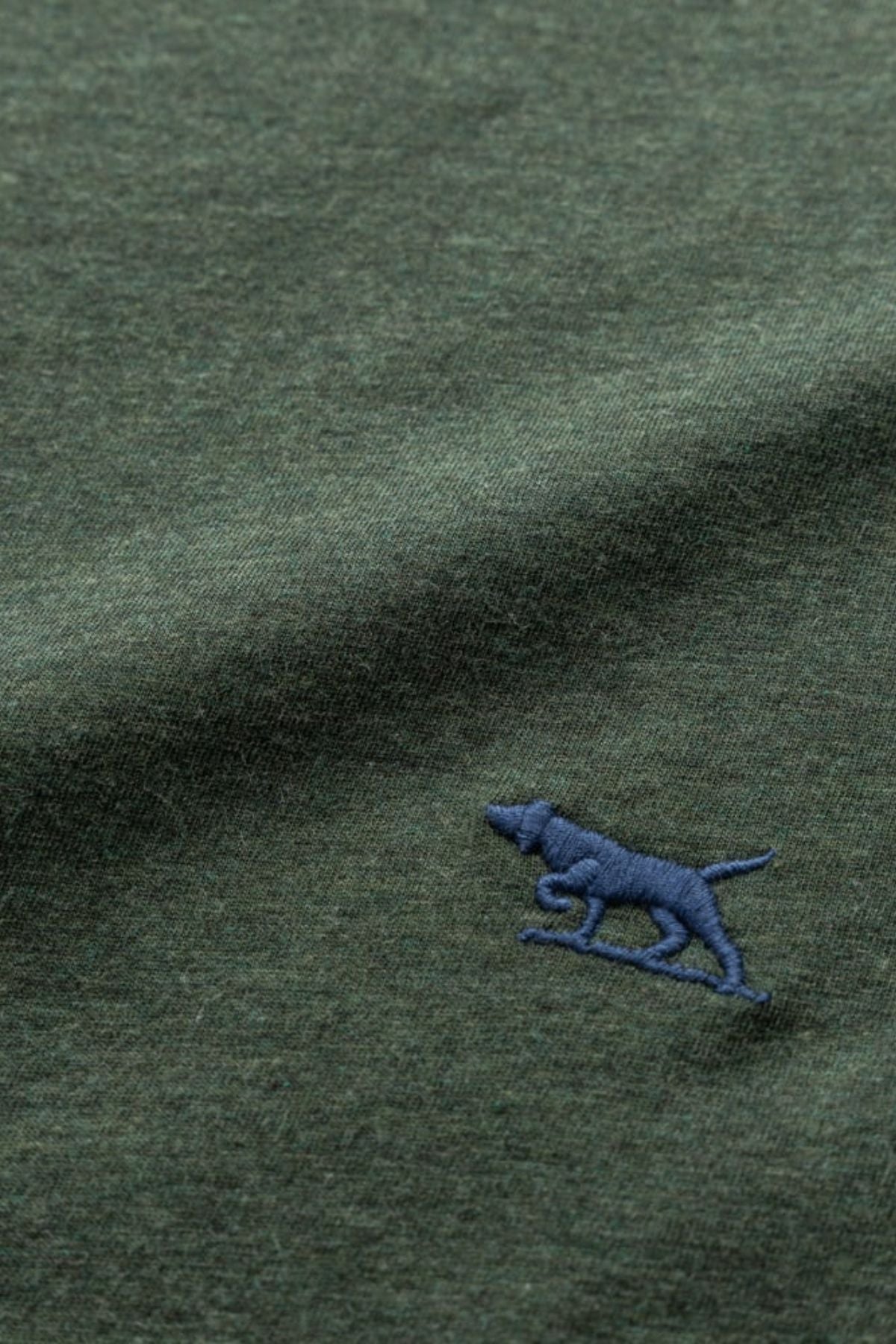 The Rodd & Gunn The Gunn T-Shirt is a casual piece made from premium Australian Cotton, featuring a green fabric adorned with a small embroidered blue dog for a unique touch.
