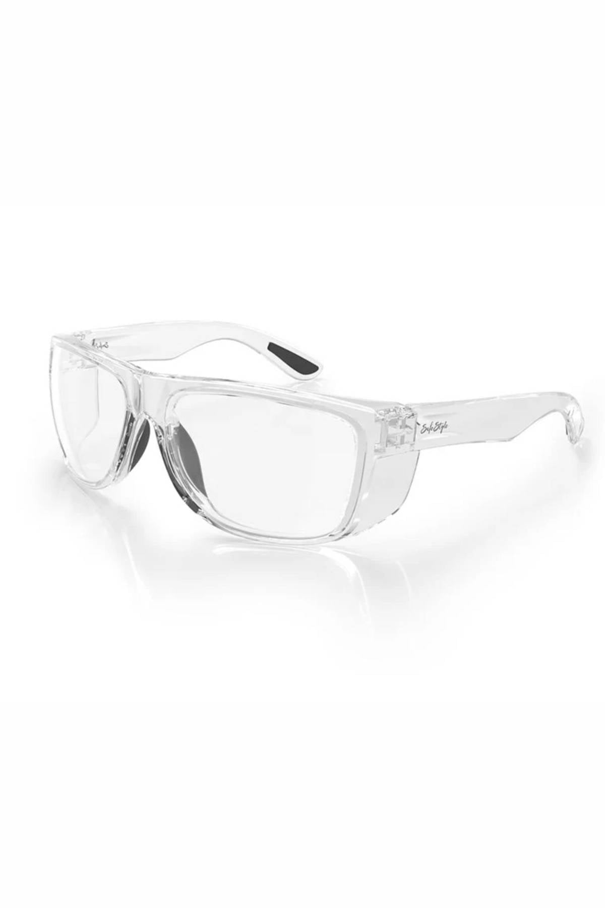 SafeStyle Rapids Clear Frame Clear Lens safety glasses with shatterproof frame and lenses, side shields for added protection, and curved arms with black non-slip grips near the ears, shown on a white background.