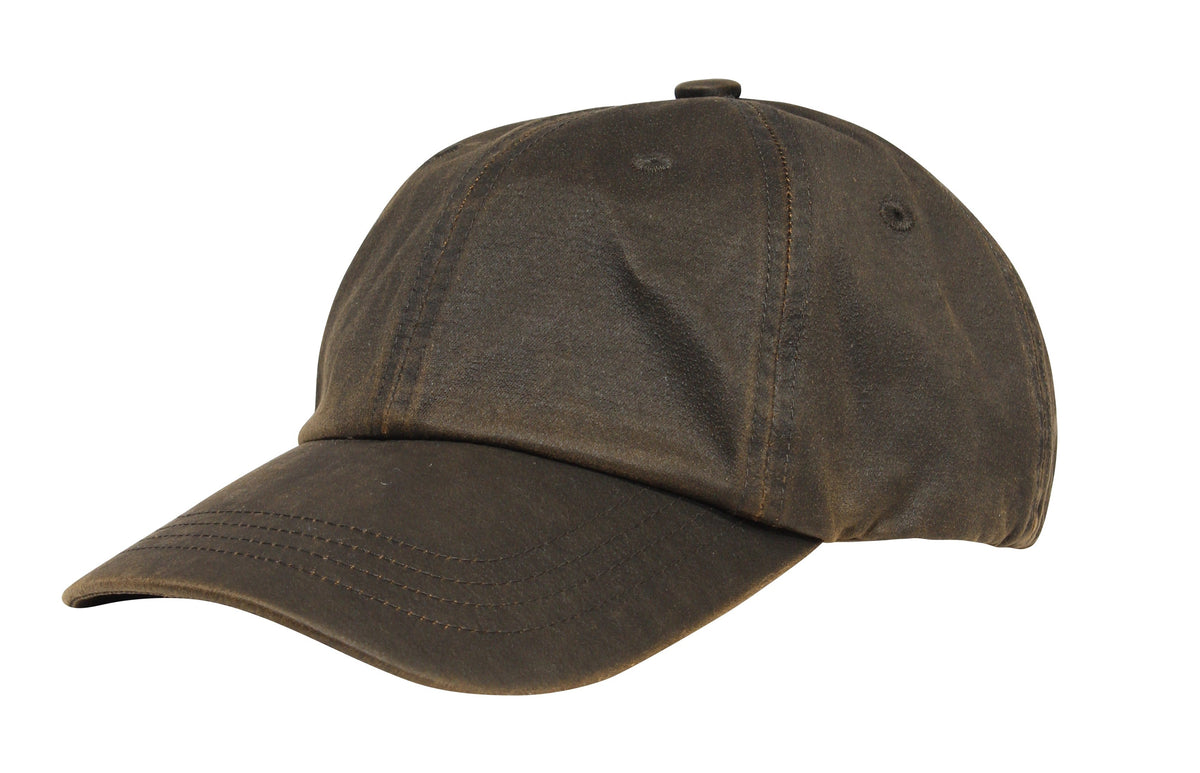 A Scala Weathered Cotton 6 Panel Cap in dark brown with a curved brim and visible stitching features a worn, textured look. It includes an adjustable strap, a button on top, and is displayed against a plain white background.