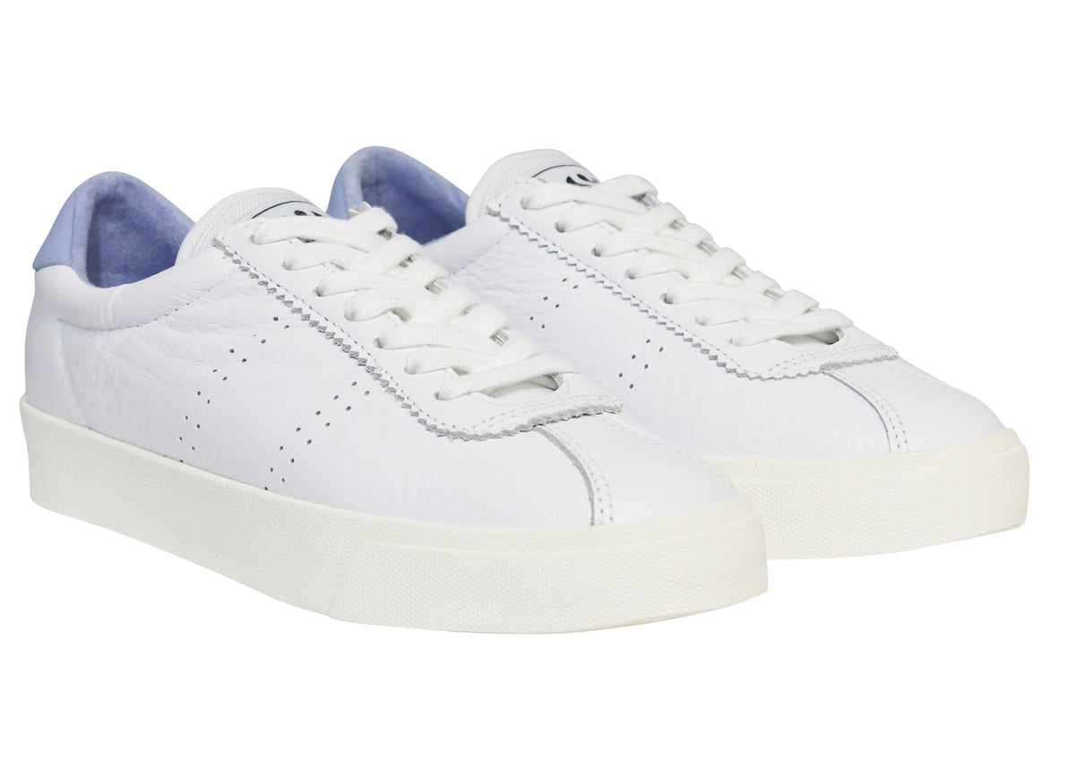 The Superga 2843 Club S Comfort Leather Sneaker features a minimalistic design with white leather, a vulcanised gum sole, and white laces. Small side perforations and a light blue interior add subtle style.
