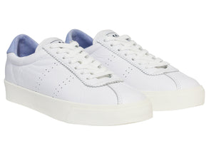 The Superga 2843 Club S Comfort Leather Sneaker features a minimalistic design with white leather, a vulcanised gum sole, and white laces. Small side perforations and a light blue interior add subtle style.
