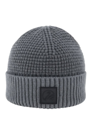 The Swanndri Newton Beanie is a gray waffle knit hat with a ribbed folded brim, textured pattern, and a black rectangular patch on the front—delivering classic style to your look.