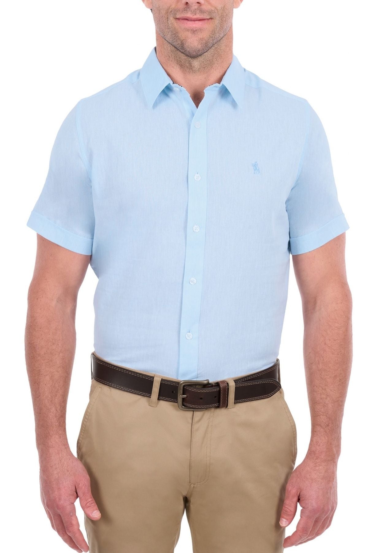 A man wearing the Thomas Cook Linen Short Sleeve Shirt in light blue, tucked into khaki pants with a dark brown belt, stands against a white background.