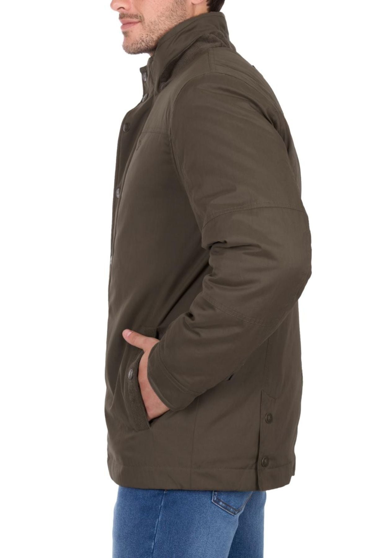 A man stands sideways, facing left, with his right hand in his pocket, wearing a brown Thomas Cook Matt Jacket and blue jeans. He presents a stylish midweight puffer look against a plain white background.