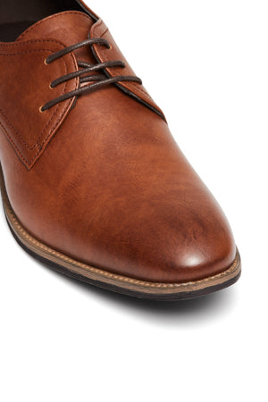 Close-up of the UNcut Rhine Shoe with a brown non-leather upper, dark brown laces, and detailed stitching, shown front and side on a white background—ideal for formal occasions.