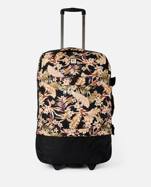 The Rip Curl F-Light Global 110L Sunday Travel Bag is a stylish travel bag featuring a black, beige, and pink floral pattern with wheels, lockable zips, and a telescopic handle for effortless transport.