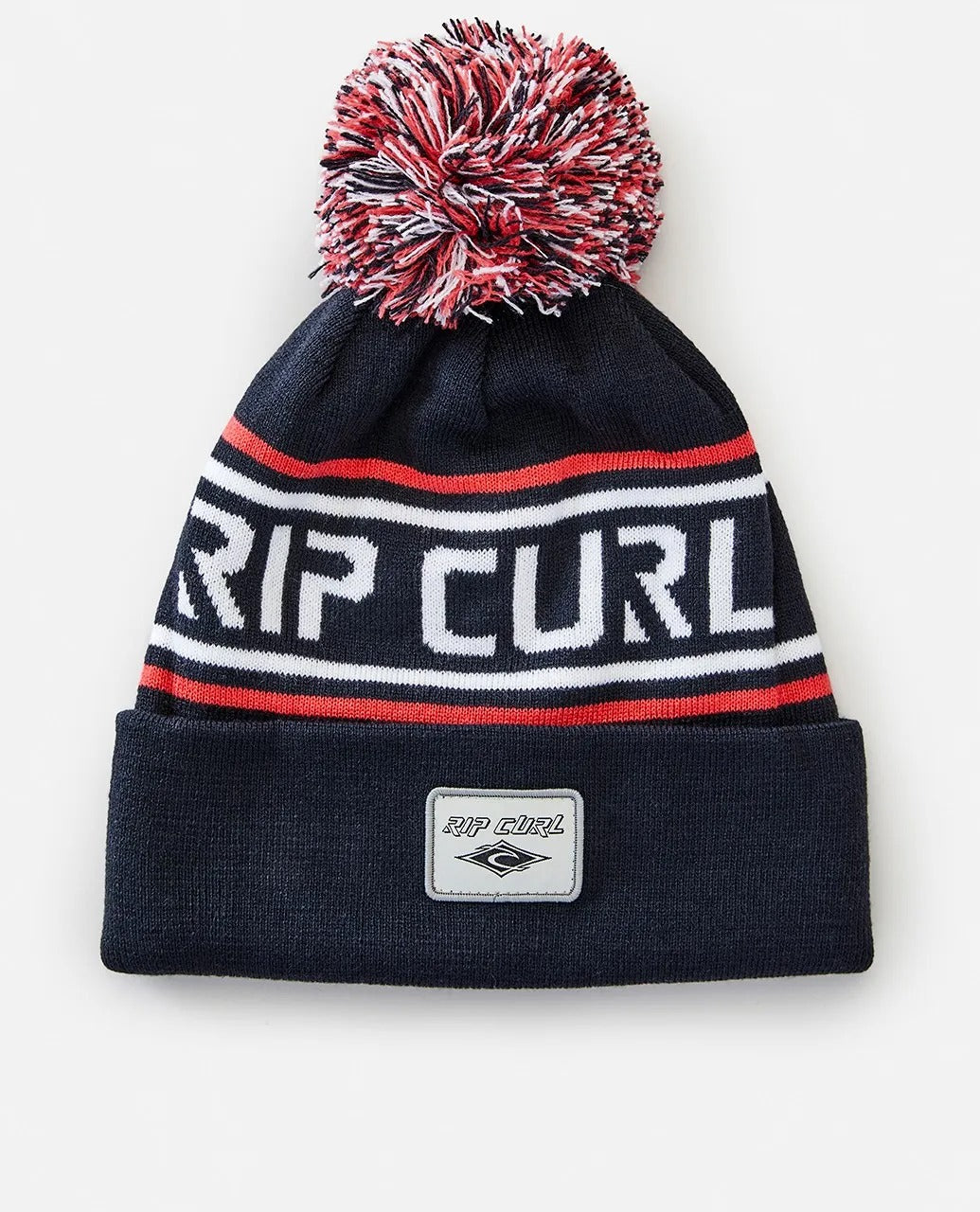 The Rip Curl Fade Out Tall Beanie is a chic black acrylic hat featuring a vibrant red, white, and black pom-pom. It showcases "RIP CURL" in white with red and white stripes and includes a small patch of the iconic Rip Curl logo in front.